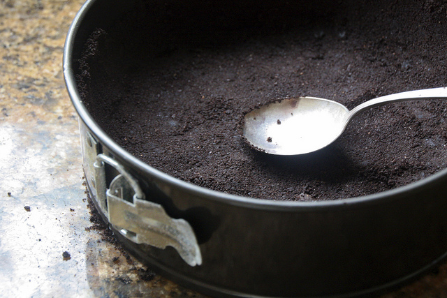 chocolate cookie crust in a spring form pan
